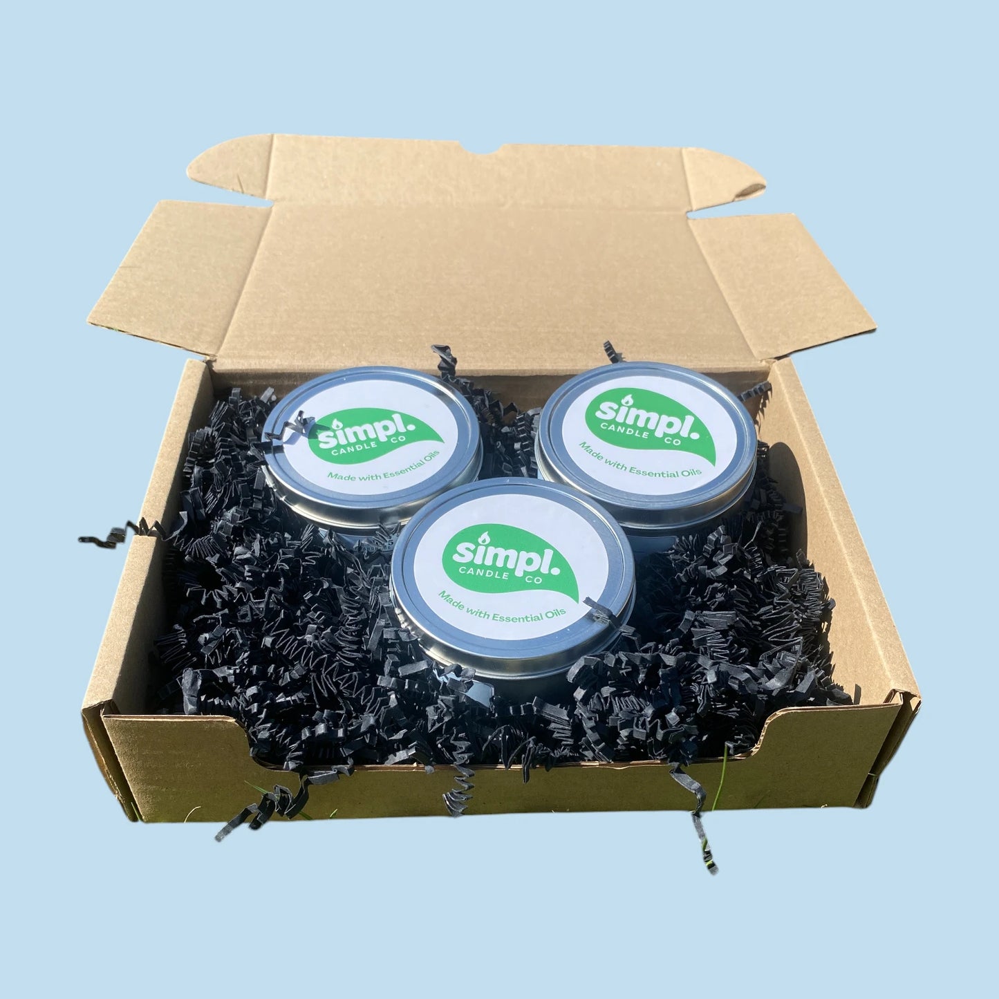 Three Simpl Candles inside a gift box, indicative of the Simpl Candle Bundle
