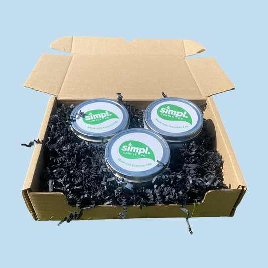 Three Simpl Candles inside a gift box, indicative of the Simpl Candle Bundle